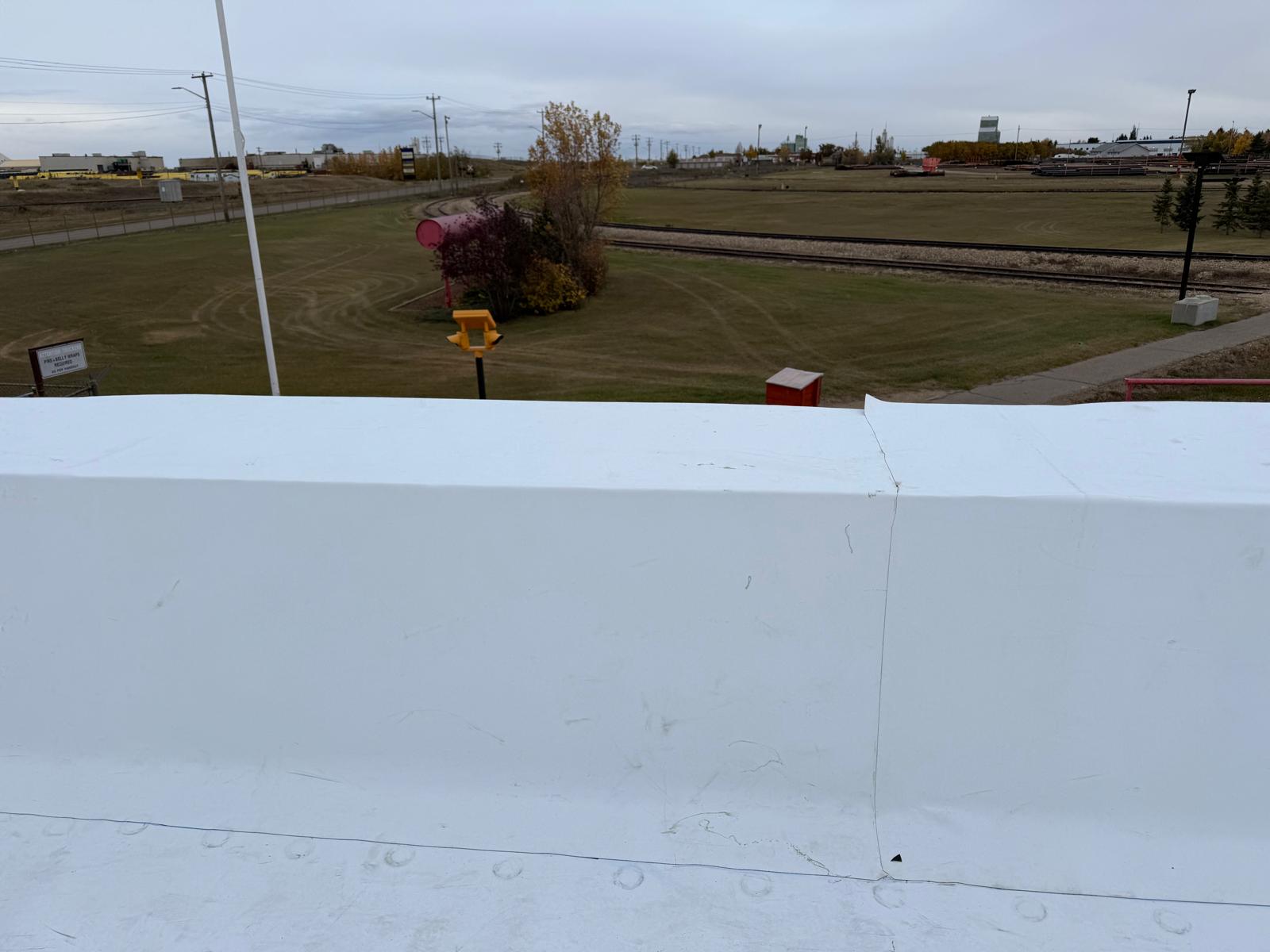 Paradigm Roofing team installing commercial roof in Edmonton