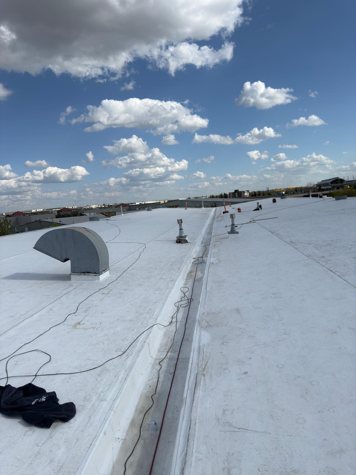 TPO roofing alongside building wall